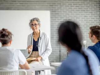 Healthcare professional in a white coat gives a seminar